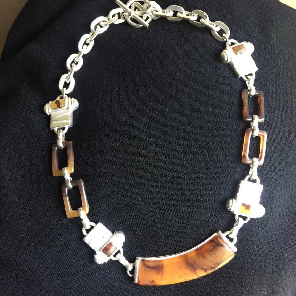 Pretty light and dark amber marbled necklace.